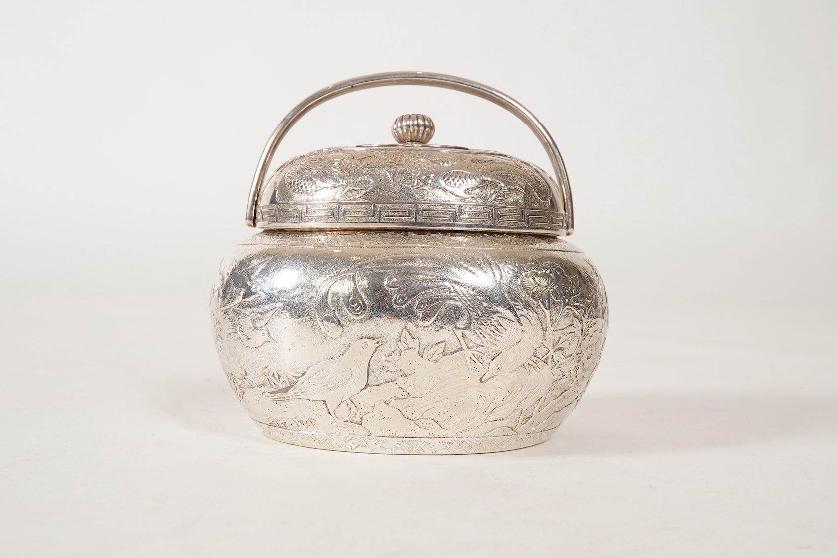 A Japanese Meiji period white metal tea caddy and cover with fluted knop, signed